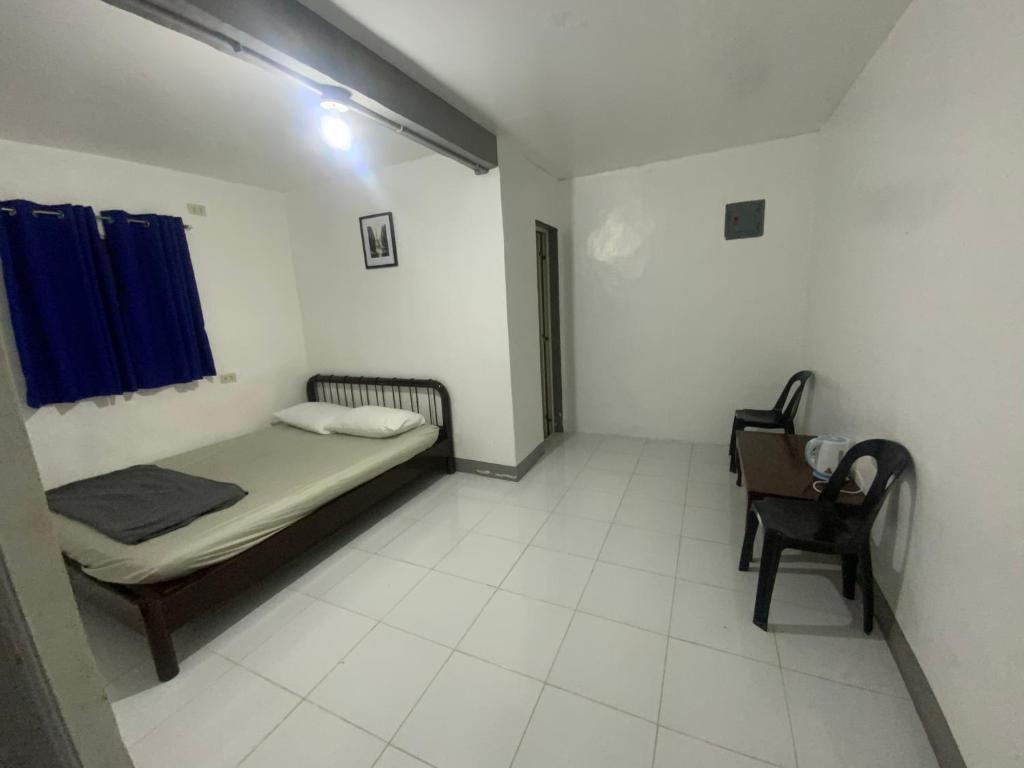 Postel nebo postele na pokoji v ubytování Chillax Inn