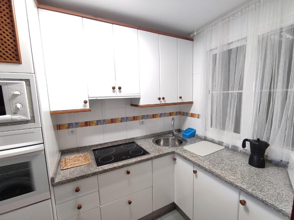 Kuchyňa alebo kuchynka v ubytovaní Flamingo Sol Home