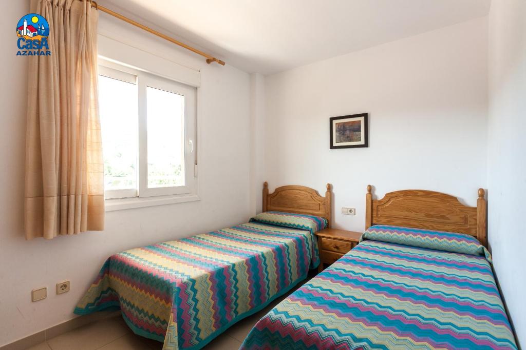 Postel nebo postele na pokoji v ubytování Apartamentos Bovalar Casa Azahar