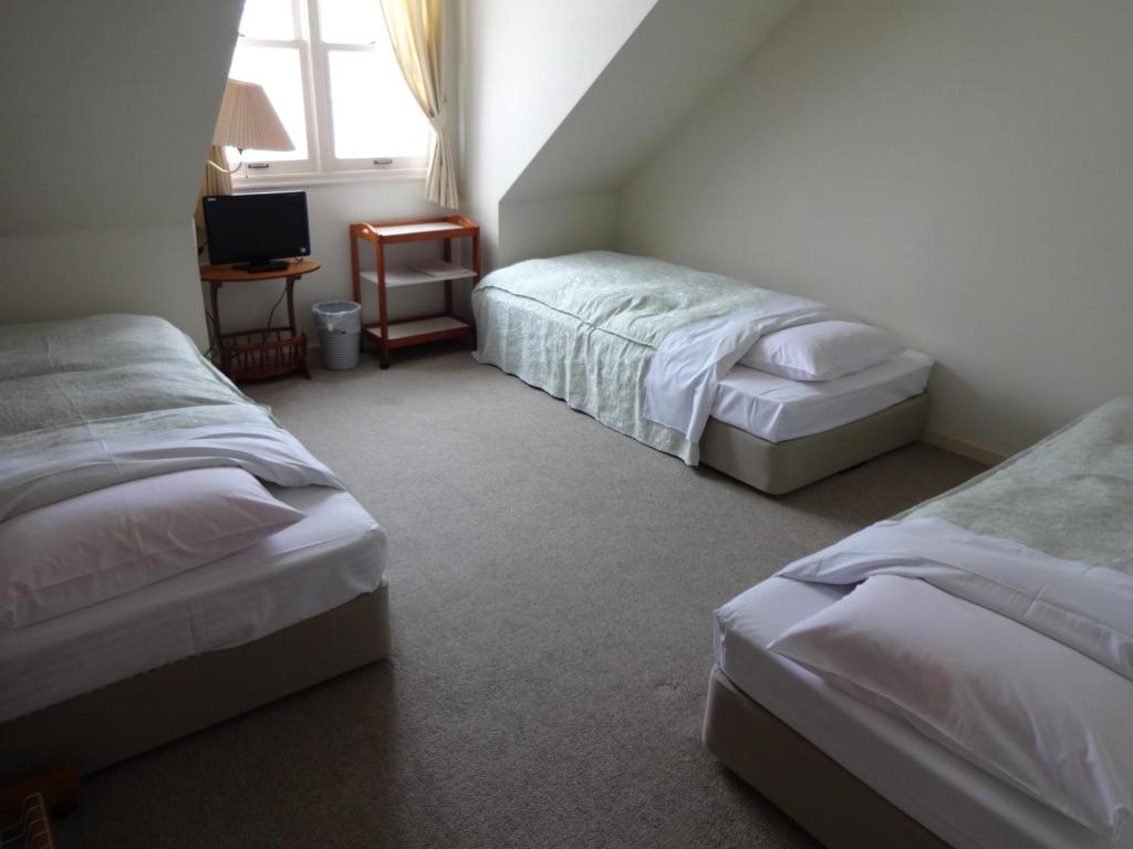 Postel nebo postele na pokoji v ubytování Guest House Bunk