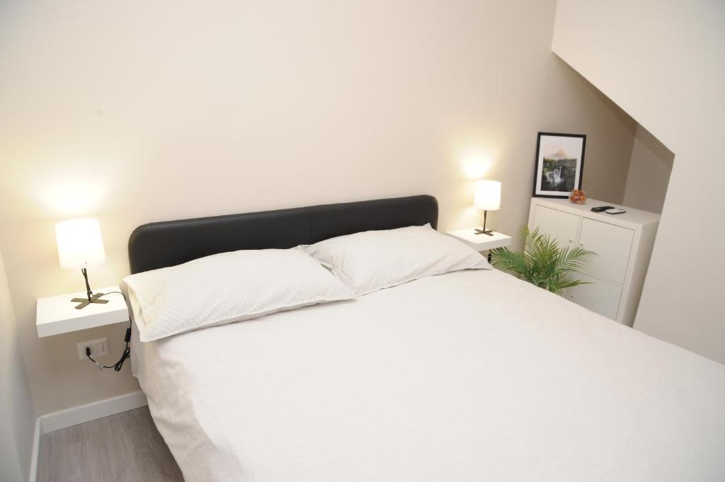 Postel nebo postele na pokoji v ubytování Maison Aphrodite