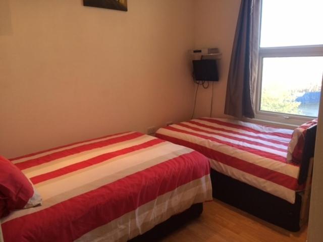 A bed or beds in a room at Nite Inn Bed & Breakfast 