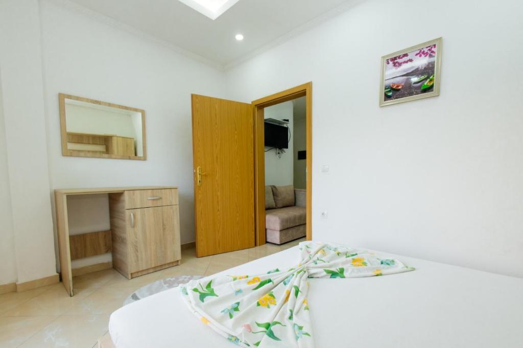 Postel nebo postele na pokoji v ubytování Flori Apartments