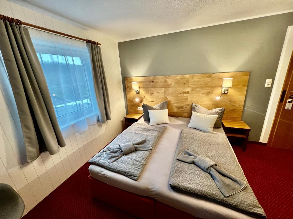 Postel nebo postele na pokoji v ubytování BnB Fliegerhaeusle Hagnau 24h Self Check In