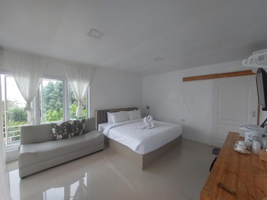 Кровать или кровати в номере White house bailan resort