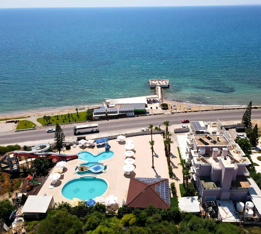 an aerial view of a resort with a pool and the ocean at Exotic Hotel & SPA in Boghaz