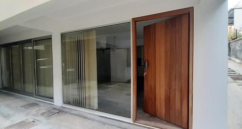 a sliding glass door on the side of a building at Koko in Larnaca