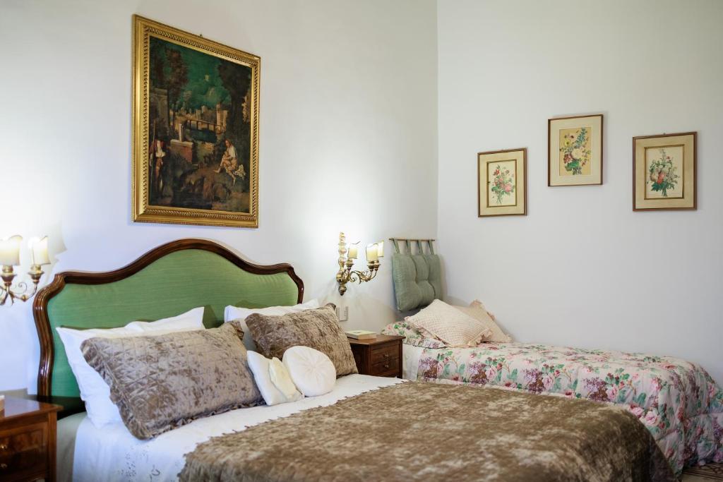 A bed or beds in a room at B&B CORSO VITTORIO
