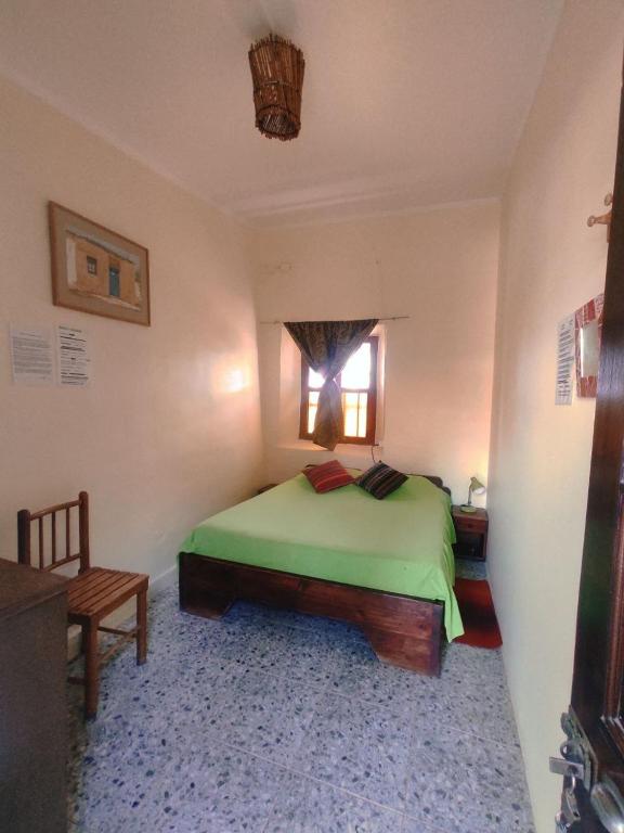 Postel nebo postele na pokoji v ubytování Hostal Sonchek