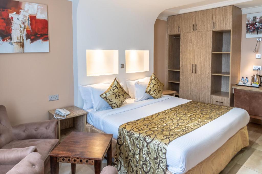 Postel nebo postele na pokoji v ubytování Hotel Waterbuck