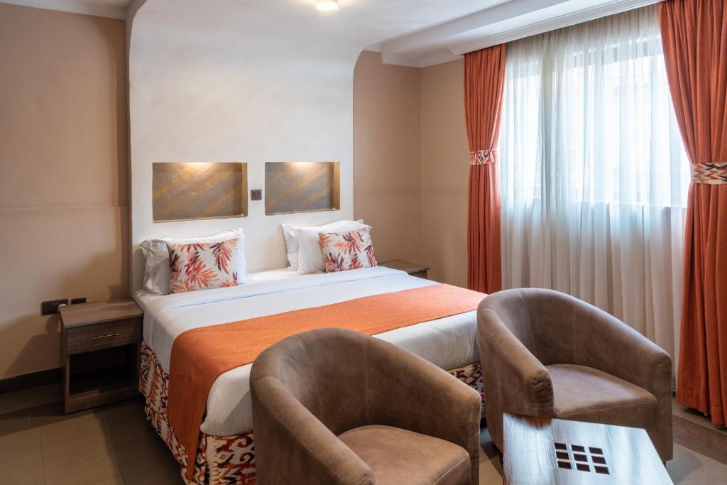 Postel nebo postele na pokoji v ubytování Hotel Waterbuck