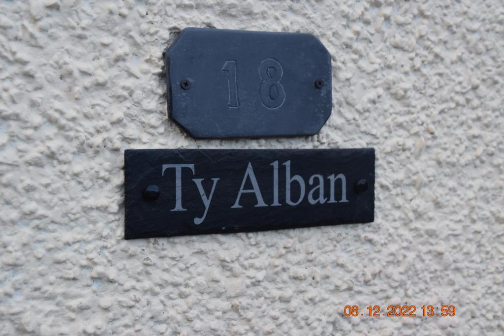 a sign that says tv alban on a wall at Ty Alban in Ffestiniog