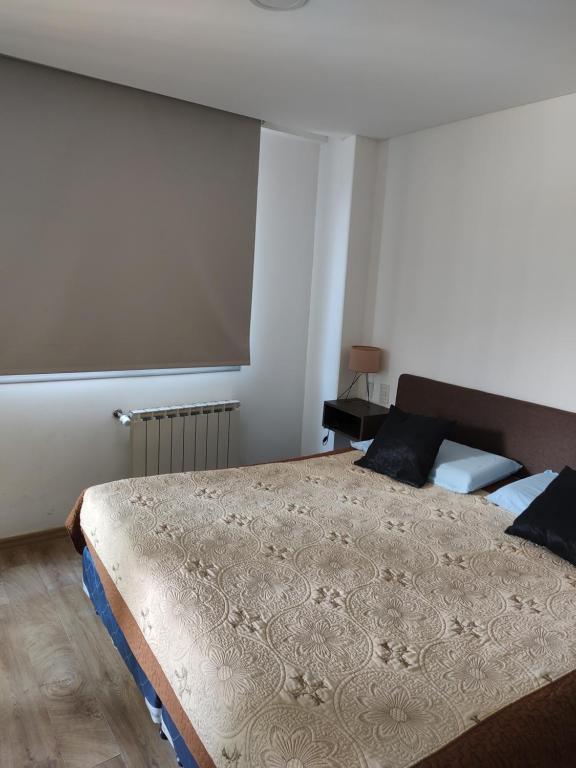 En eller flere senge i et værelse på Luxury Suite Salta