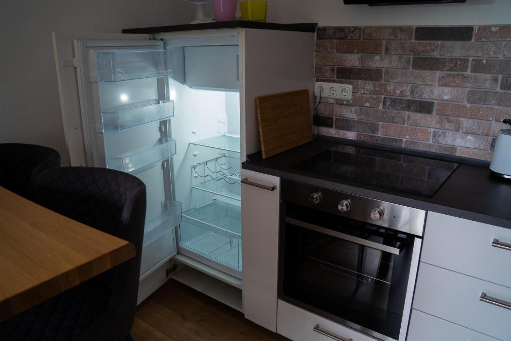 Kuchyň nebo kuchyňský kout v ubytování Appartement No 5