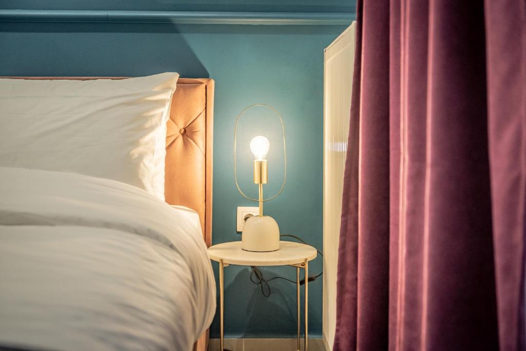 Posteľ alebo postele v izbe v ubytovaní Artemis Apartment Midas Home Project