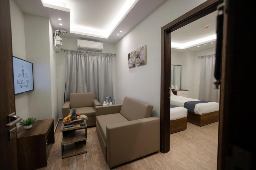 Postel nebo postele na pokoji v ubytování Royal Inn Residence New Cairo