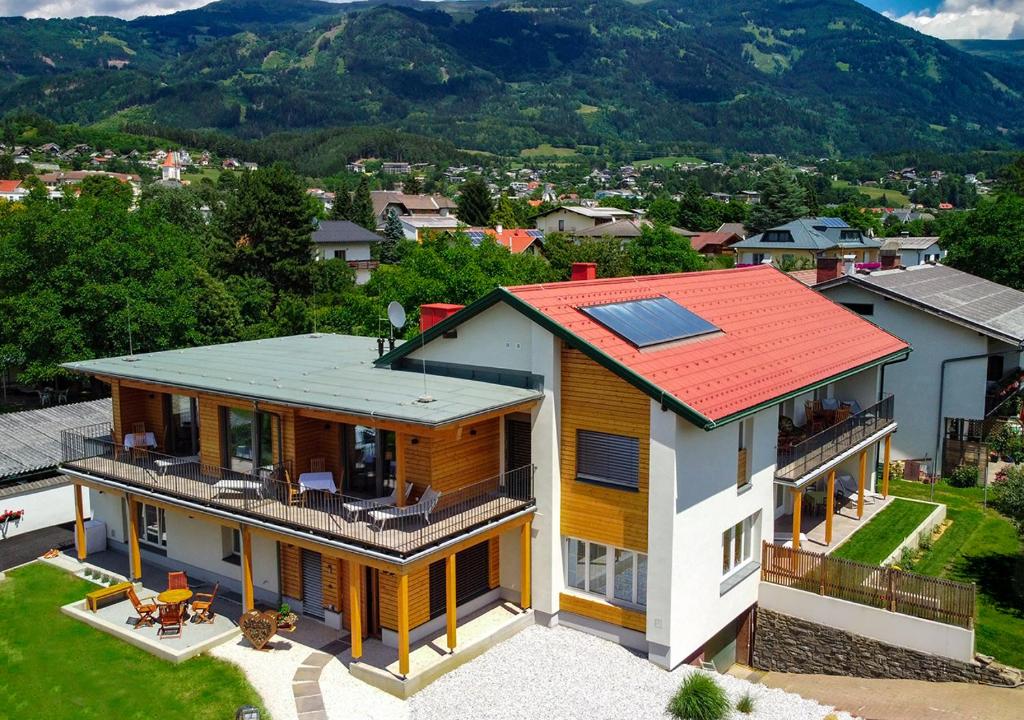 an aerial view of a house with a solar roof at Seespitz 37 - Ferienwohnungen Eisendle in Seeboden