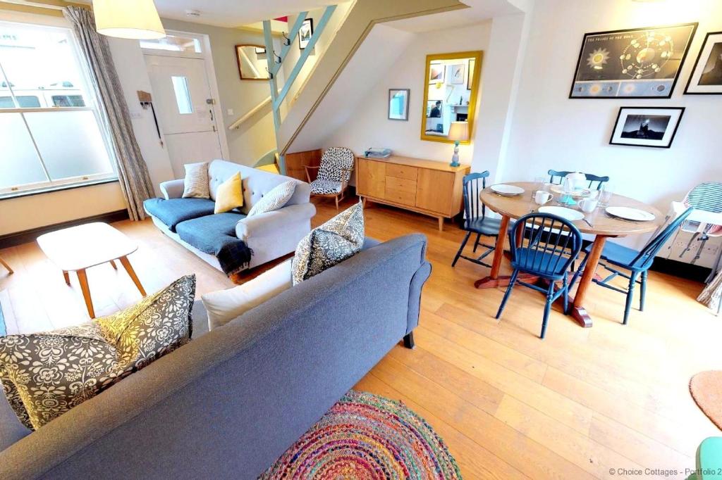a living room with a couch and a table at BRAUNTON SAMPHIRE 2 Bedrooms in Braunton