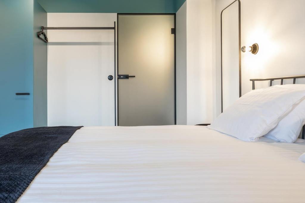 Łóżko lub łóżka w pokoju w obiekcie Odra Apartments