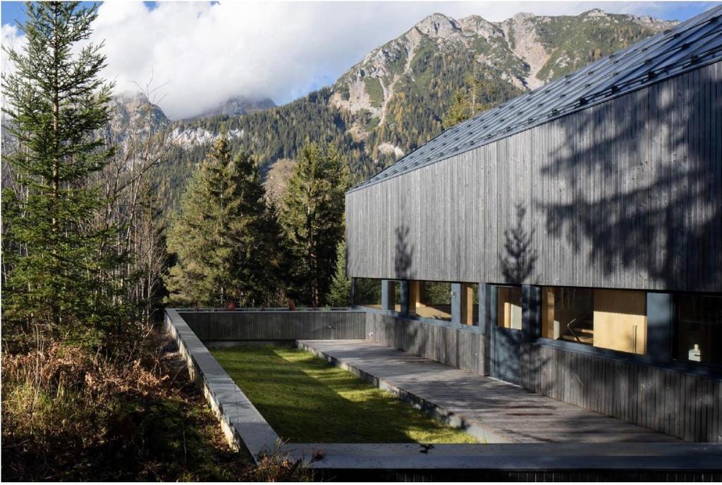 a house with a view of a mountain at Chalet Dachstein in Ramsau am Dachstein