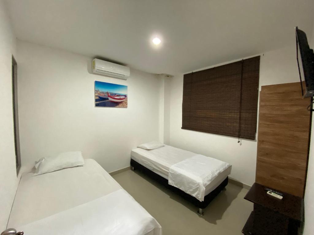 Krevet ili kreveti u jedinici u okviru objekta Apartamento la Isla 1-Coveñas