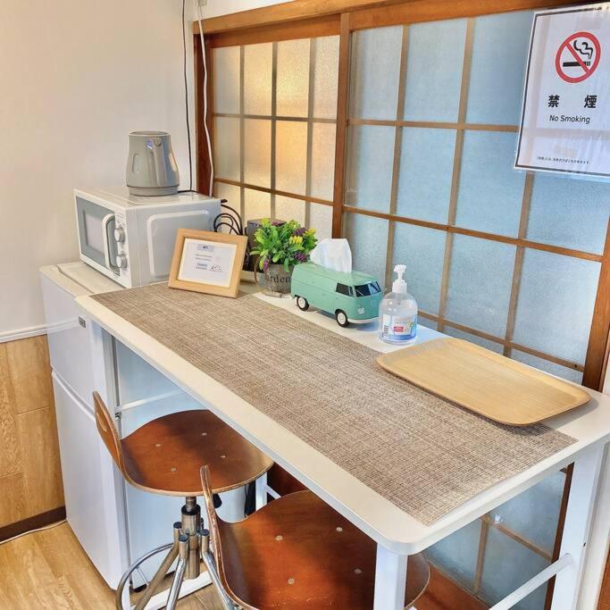 Снимка в галерията на 天下茶屋駅5分、専用庭付き平屋—KIK Iハウス в Осака