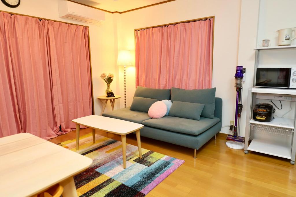 TV a/nebo společenská místnost v ubytování Guest House Kubo Homes Matsu