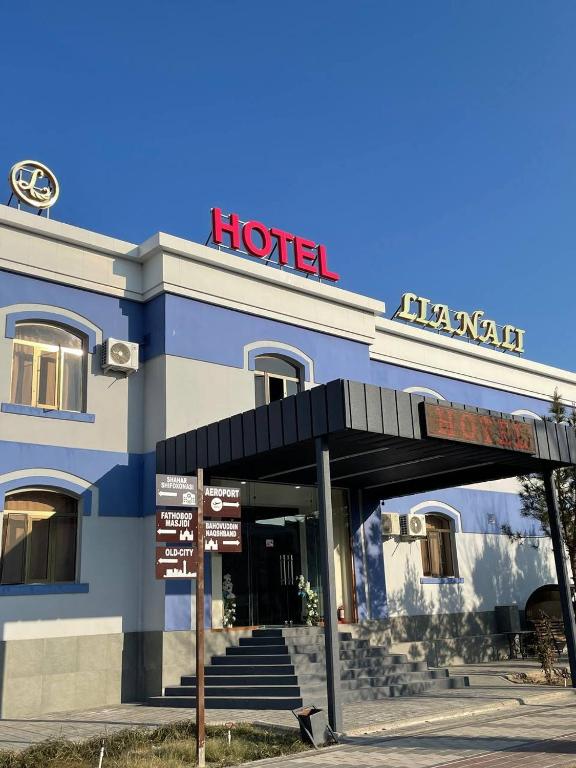 a hotel with a sign in front of it at LIANALI HOTEL in Bukhara