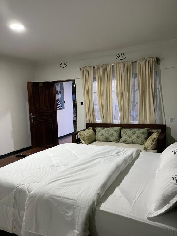 Postel nebo postele na pokoji v ubytování Koselig Homes