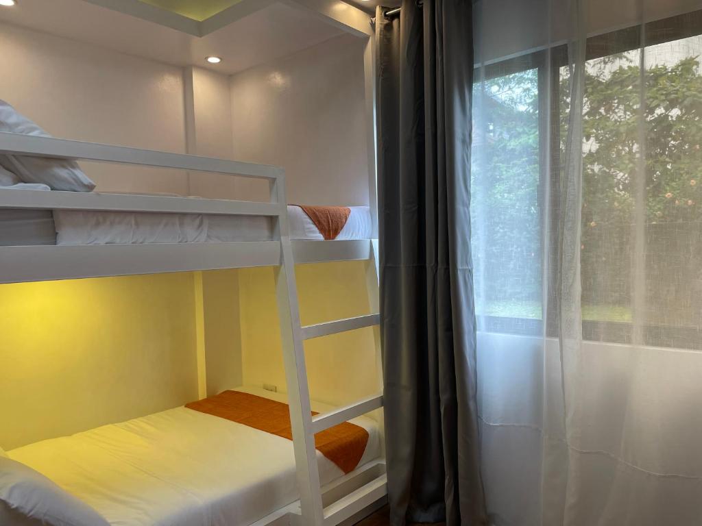 Postel nebo postele na pokoji v ubytování Rangya Hotel