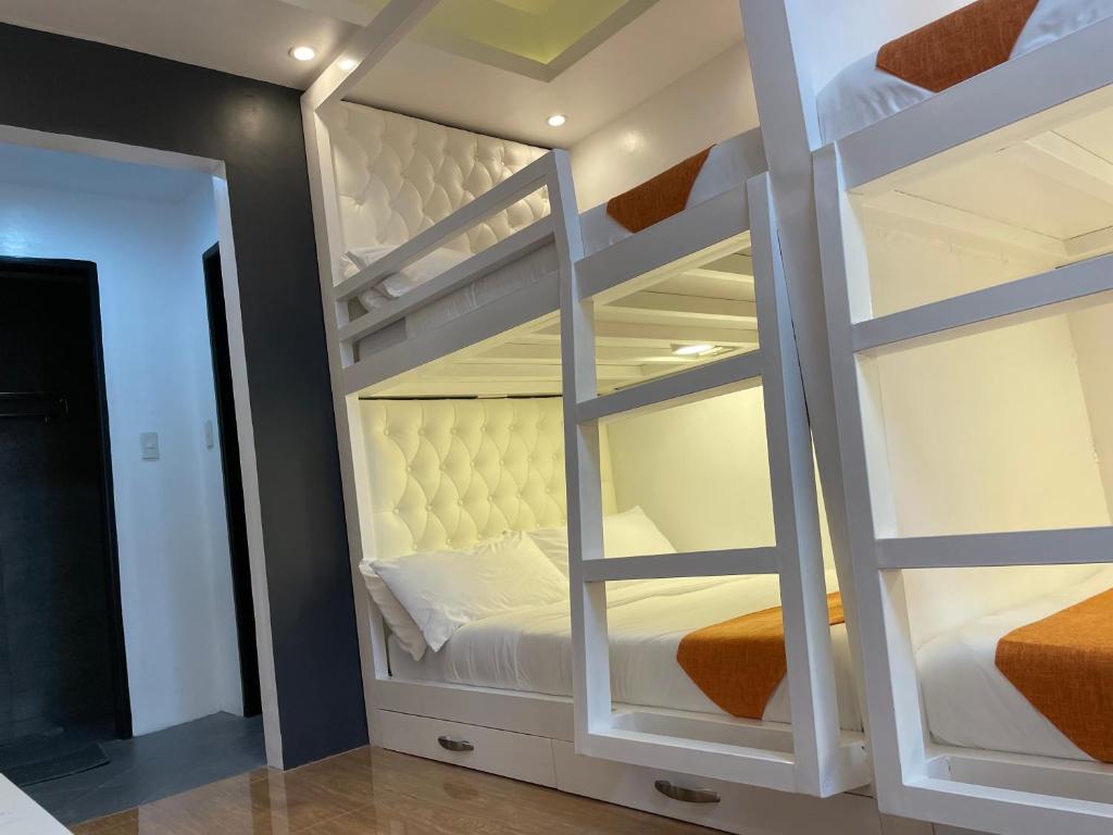 Postel nebo postele na pokoji v ubytování Rangya Hotel