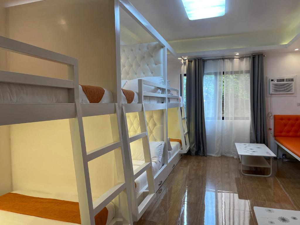Postel nebo postele na pokoji v ubytování Rangya Hotel