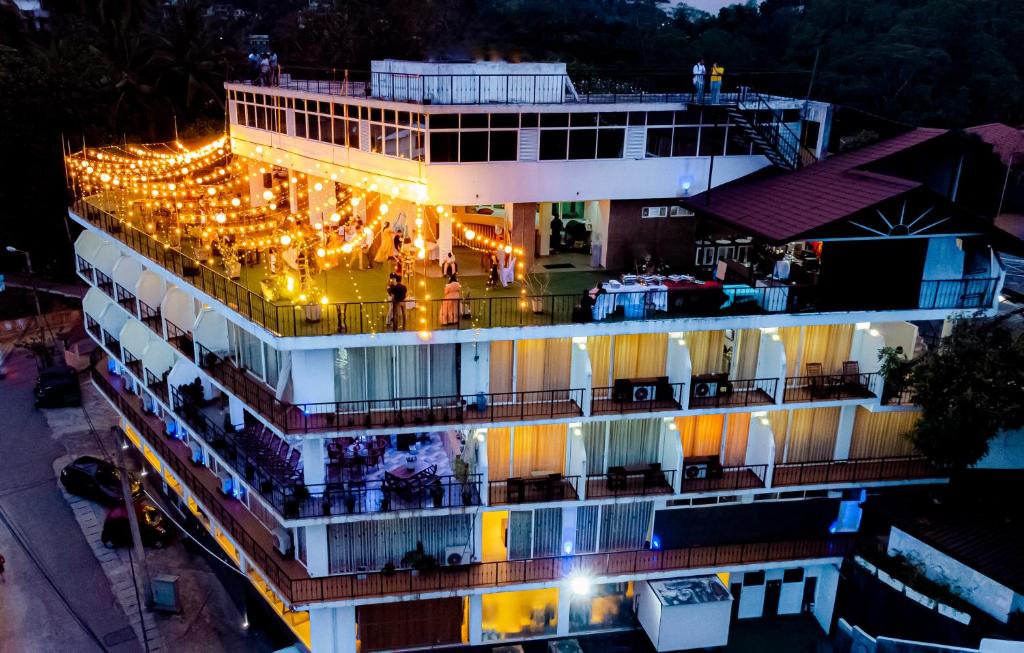 an aerial view of a building with lights on it at Sky View Grand in Kandy