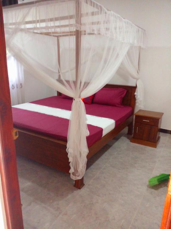 Postel nebo postele na pokoji v ubytování Sandew Residence