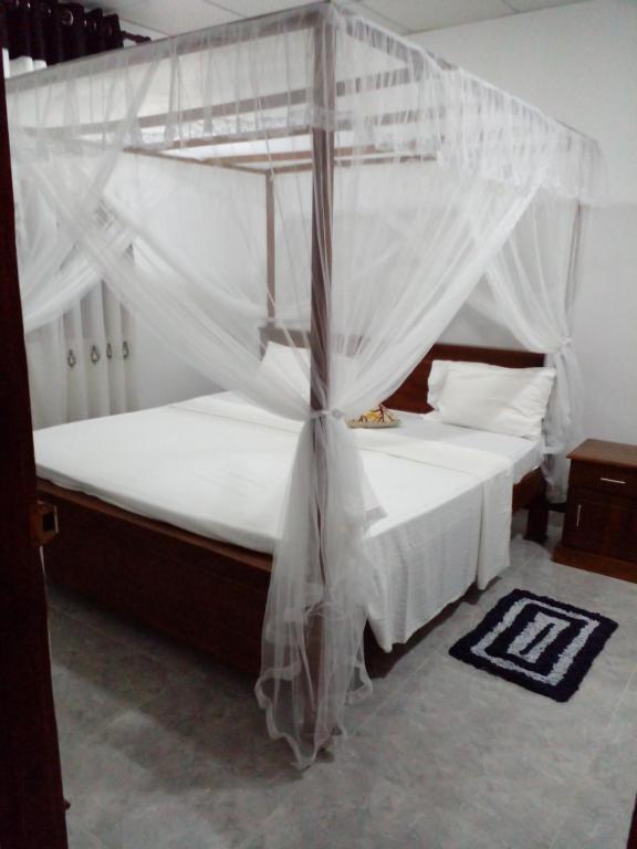 Postel nebo postele na pokoji v ubytování Sandew Residence