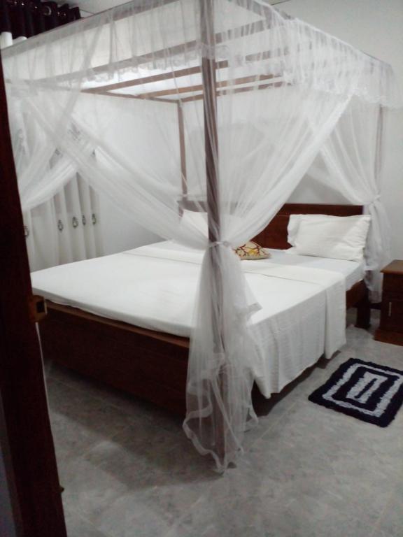 Postel nebo postele na pokoji v ubytování Sandew Residence