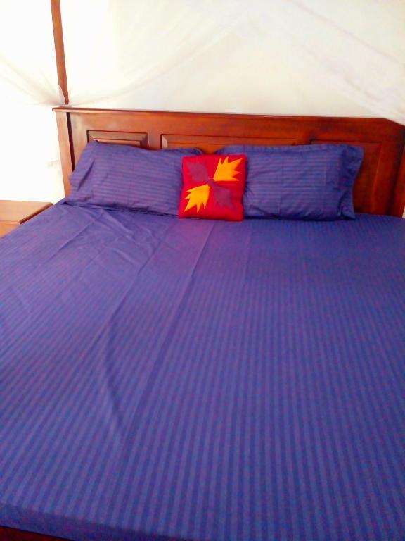 Postel nebo postele na pokoji v ubytování Sandew Residence