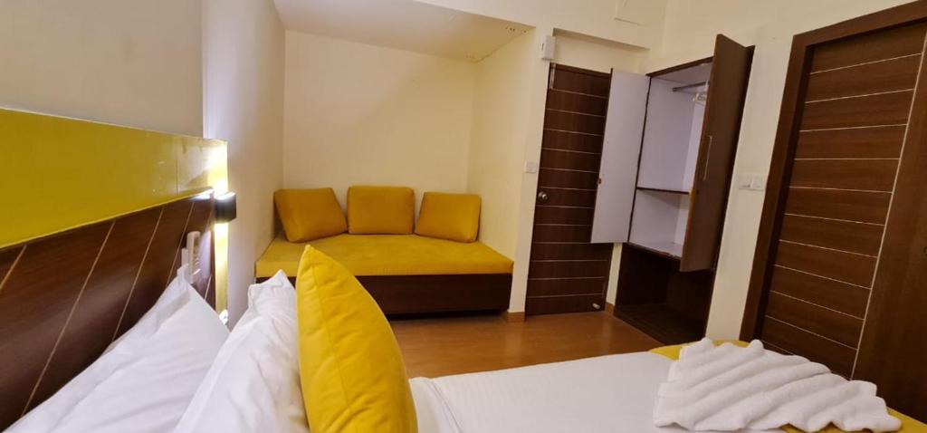 Postel nebo postele na pokoji v ubytování Ronaldos Hotel & Restaurants Baga