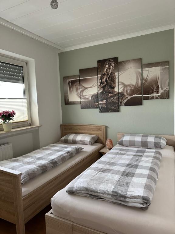Postel nebo postele na pokoji v ubytování FeWo-City