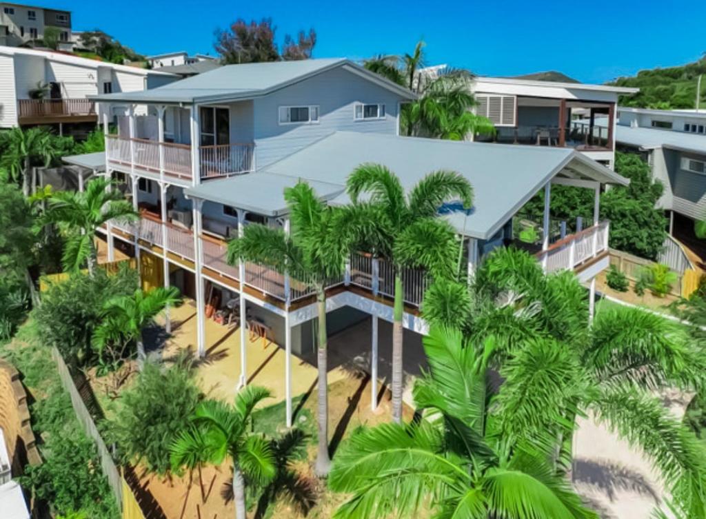 an aerial view of a house with palm trees at Lammermoor Lodge Holiday Home Yeppoon in Yeppoon