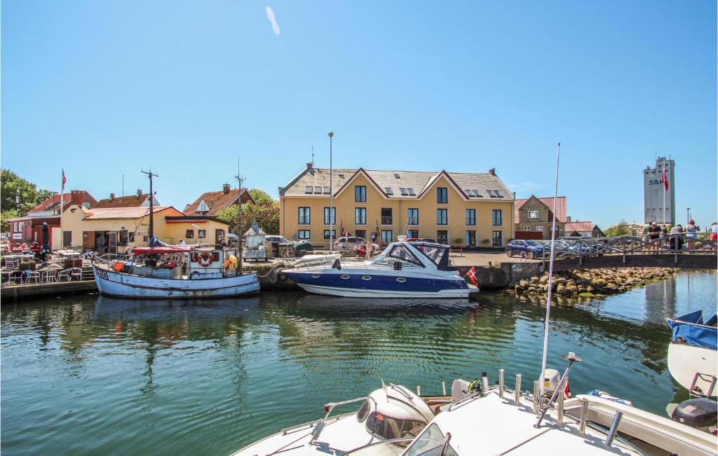 a group of boats are docked in a harbor at Cozy Apartment In Sams With House Sea View in Ballen