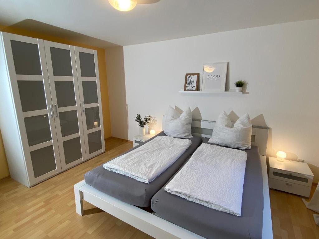 a bedroom with a bed with two white pillows at Ferienwohnung Vater Rhein Mittelrheintal in Sankt Goar