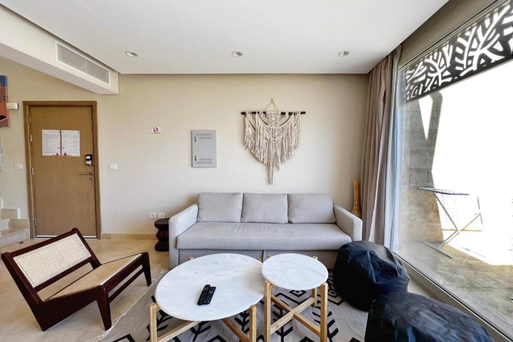 A seating area at Spectacular & Soaring 2 BDR w Private Rooftop Jacuzzi & Beach Access