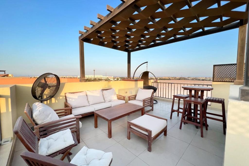 En balkon eller terrasse på Eclectic 2 BDR Twin House Tawila El Gouna