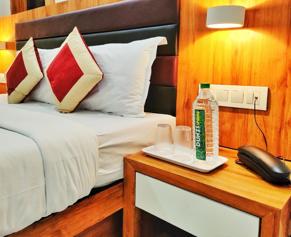 Postel nebo postele na pokoji v ubytování Gateway Suites