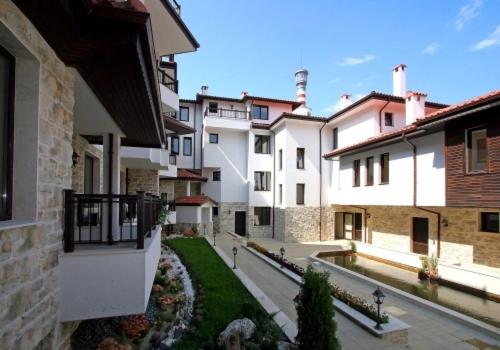 a group of buildings in a city with a courtyard at Sozopol Dreams Apartments in Sozopol