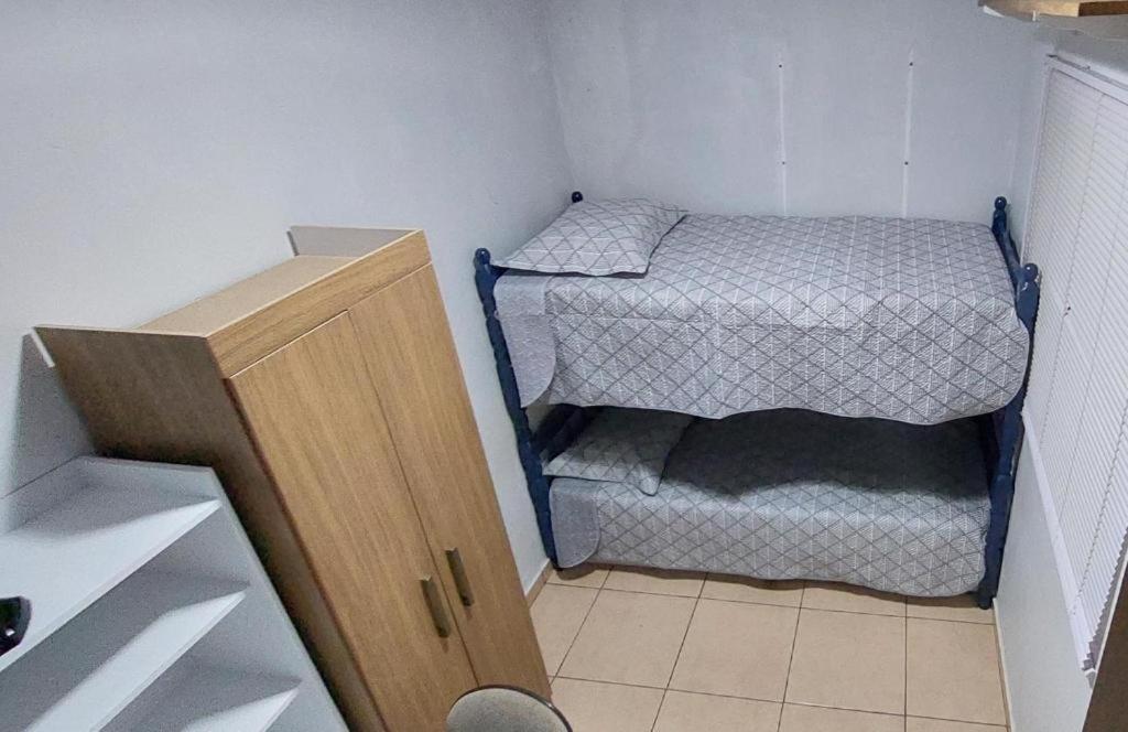 Postel nebo postele na pokoji v ubytování Quarto Deluxe em Foz piscina wifi estacionamento cozinha E AR