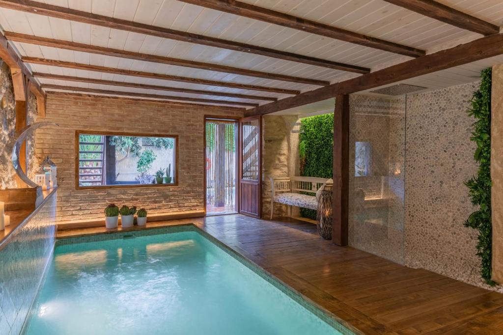 a swimming pool in a house at Casa Rural La Tahona in Elche de la Sierra