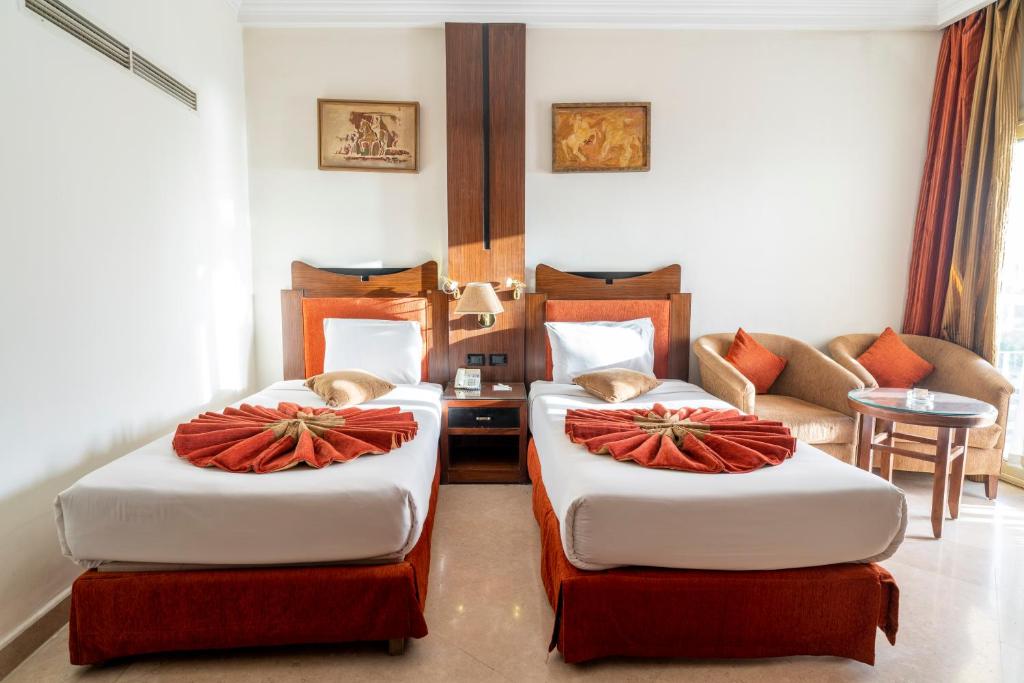 Postel nebo postele na pokoji v ubytování Aracan Eatabe Luxor Hotel
