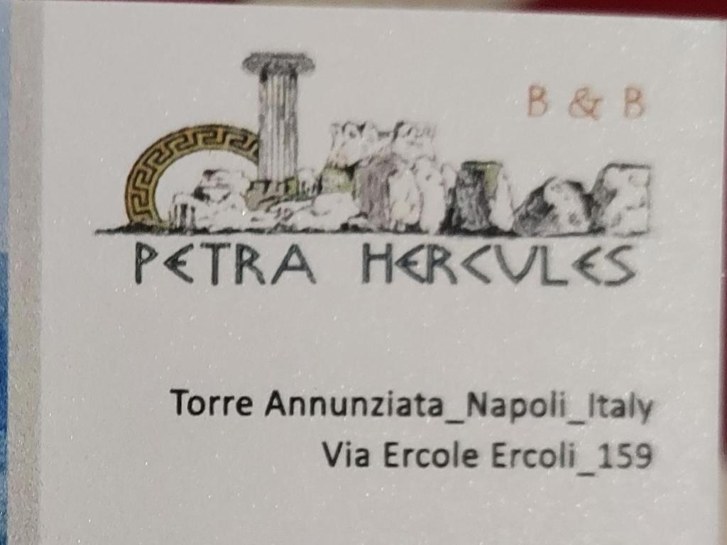 ein Zeichen für eine reria havasica mit einem Bild in der Unterkunft B&B Petra Hercules in Torre Annunziata